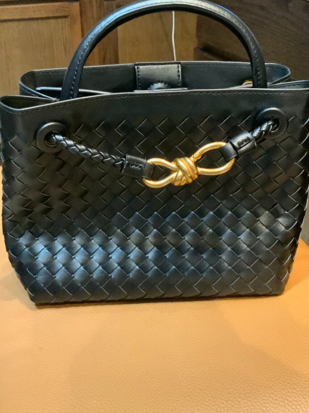 Designer Style Black Woven Handbag with Gold accents Beautiful